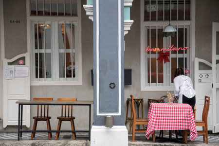 Singapore - Dec 29, 20120: Empty tables in front of traditional shop house in Chinatown Singapore