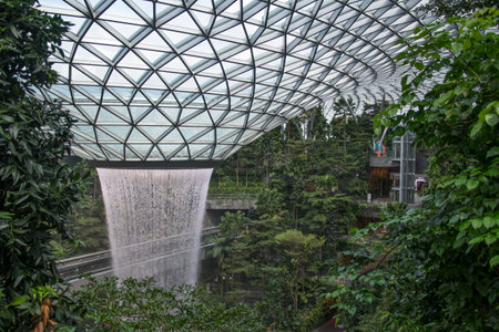 Singapore - Dec 31, 20120: General view of the tallest indoor waterfall in the world at Jewel Changi Singapore, surrounded by terraced forests.のeditorial素材