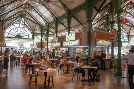 Singapore- 11 Oct, 2021: People enjoying food at the Lau Pa Sat foodcourt. Lau Pa Sat is a historic building located within the Downtown in Singapore.のeditorial素材