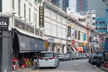 Singapore- 23 Oct, 2021: Streets with old houses and shops on the background of modern buildings in Singapore.のeditorial素材
