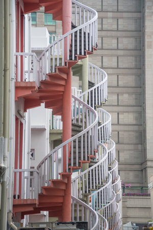 Singapore- 24Oct, 2021: Close up of colorful pastel spiral staircases in Singapore. It is a popular...