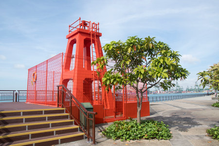 Singapore Dec 29 2021: The Berlayer Point Lighthouse in Labrador Nature Reserve. Built in 1930, this lighthouse acts as the port side navigation guide for ships approaching the channel.のeditorial素材