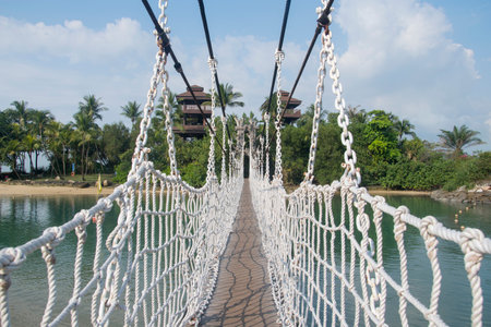 Singapore- Apr 2, 2022: Palawan Beach hanging bridge in Sentosa, Singapore. Palawan Beach lies in the centre of the southern coast of Sentosa, Singapore.のeditorial素材
