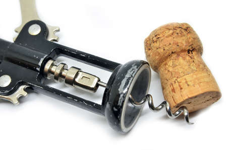 Vvintage wooden corkscrew bottle opener and red wine cork isolated on white background