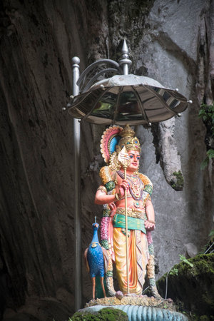Kuala Lumpur, Malaysia - Jun 06, 2022: Statue of Hindu god at the Batu caves in Kuala Lumpur, Malaysia.  Batu Caves is a complex of limestone caves.のeditorial素材