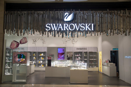 Genting, Malaysia - Jun 10, 2022: Swarovski swan symbol and logo on a store front in Genting Highlands, Malaysia.のeditorial素材