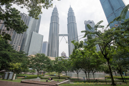 Kuala Lumpur, Malaysia - Jun 07, 2022: Famous Petronas Twin  in Kuala Lumpur. View from KLCC park.