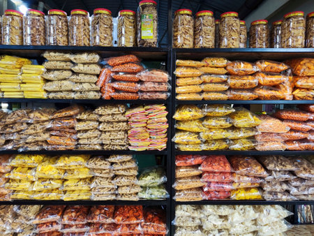 Johor Bahru, Malaysia- 23 Jul, 2022: Variety of home made local Malaysian tasty snacks repacked in attractive plastic packaging.のeditorial素材