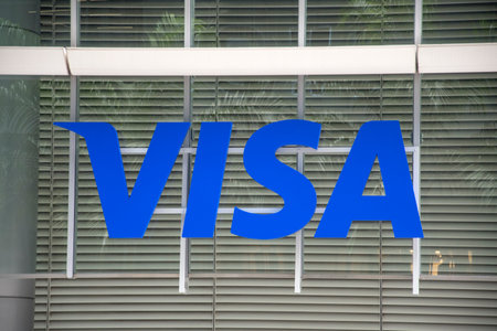 Singapore- 6 Nov,2022: Banner with VISA word hanging on the wall in Singapore.のeditorial素材