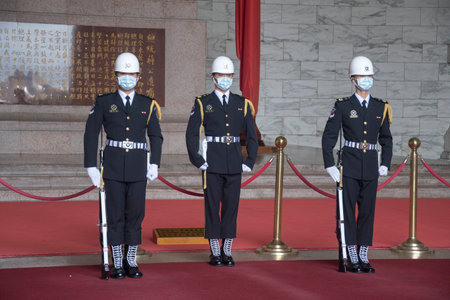 Taipei, Taiwan- 3 Dec, 2022:  The changing of the guards ceremony against the statue of Chiang...