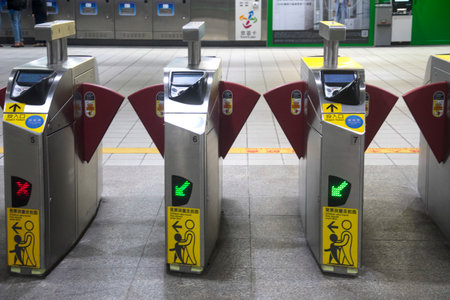 Taipei, Taiwan- 4 Dec, 2022: Taipei metro station hall and platform. Subway passengers walk through...