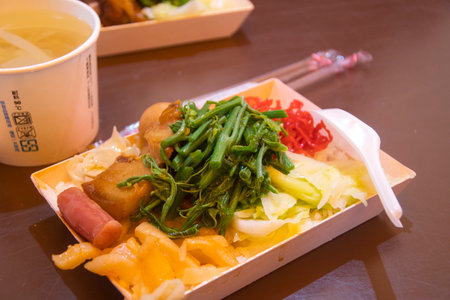Fenqihu, Taiwan- 6 Dec, 2022: Railway lunch box with pork and vegetable in bento box style from Fenqihu.Fenchihu lunchbox has been widely known for more than half a centuryのeditorial素材