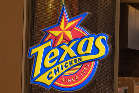 Johor Bahru, Malaysia- 3 Feb, 2023- Logo of Texas Chicken restaurant in Johor Bahru, Malaysia. Texas Chicken is an American fast food restaurant chain that specializes in fried chickenのeditorial素材