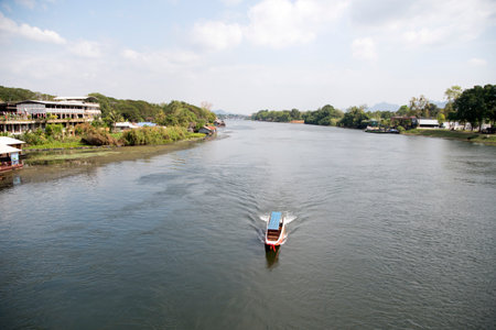 Kanchanaburi, Thailand- 16 Feb, 2023: Longtail boat, traditional wooden boat, travels on River Kwai. Longtail boat is a type of watercraft native to Southeast Asiaのeditorial素材