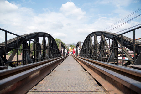 Kanchanaburi , Thailand- 16 Feb, 2023: Tourists walk on the River Kwai Bridge or Death railway bridge in Kanchanaburi, Thailand. It was part of the meter-gauge railway constructed by the Japanese during WW 2のeditorial素材