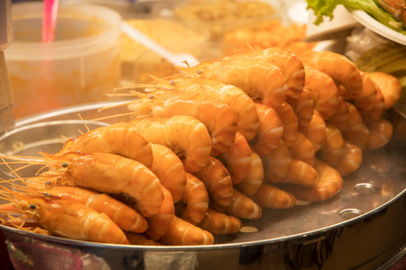 Delicious steamed prawns or shrimps at street market food court in Bangkokの写真素材