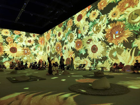 Singapore- 4 Jan, 2023: Visitors walking inside the ArtScience Museum Singapore while looking at magical lightのeditorial素材