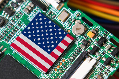 Flag of the USA on semiconductor chip or microchip on a motherboardの写真素材