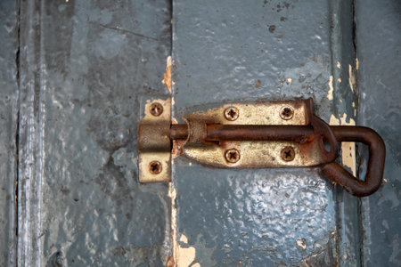 Metal sliding lock on wooden door. Security conceptの写真素材