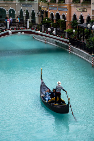 Manila, Philippines-16 Oct 2023: Gondolas carrying tourists at the Venice Grand Canal Mall, Manila. Venice Grand Canal Mall is an Italian-themed lifestyle destination mall.のeditorial素材