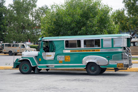 Angeles city, Philippines- 18 Oct 2023: A jeepney parked on the road sign in Angeles city. Jeepneys sometimes called jeeps are minibus-like public utility vehiclesのeditorial素材