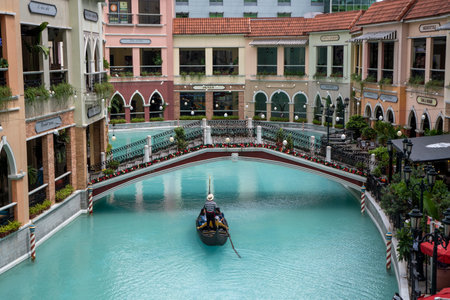Manila, Philippines-16 Oct 2023: Gondolas carrying tourists at the Venice Grand Canal Mall, Manila. Venice Grand Canal Mall is an Italian-themed lifestyle destination mall.のeditorial素材