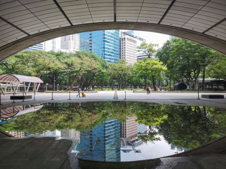 Manila, Philippines-15 Oct 2023: View of Ayala Triangle Gardens in Manila. It is a triangular public garden and courtyard in the center of the Makati Central Business District.のeditorial素材