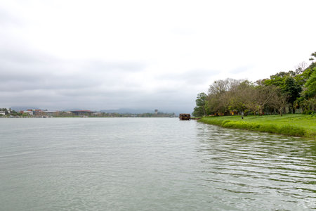 Riverbank and garden along the Perfume River in Hue city, Vietnamの写真素材