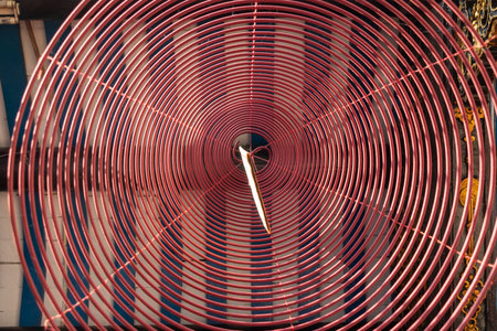 Spiral incense hang from the roof inside the temple in Hoi An, Vietnam