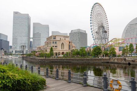 Yokohama, Japan- 19 May 2024: The big Cosmo Clock 21 Ferris Wheel in Yokohama, Japan. The Ferris wheel is brilliantly illuminated at nightのeditorial素材