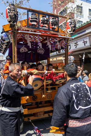 Tokyo, Japan- 18 May 2024: People carrying a portable shrine (mikoshi) at the Sanja Festival in Asakusa. It is one of the most popular festivals in Tokyo.のeditorial素材