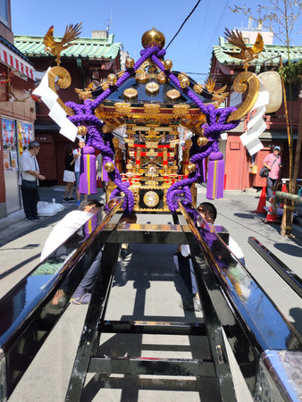 Tokyo, Japan- 18 May 2024: People prepare a portable shrine in a side street close to the senso-ji...