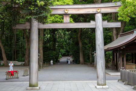Tokyo, Japan- 12 May 2024: Torii Gate standing at the entrance to Meiji Jingu Shrine in Tokyo, Japan. It is dedicated to the deified spirits of Emperor Meiji and his wife,のeditorial素材