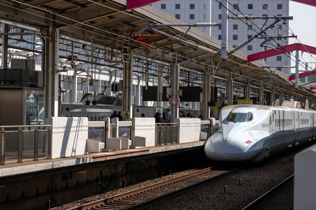 Okayama, Japan- 10 May 2024: Bullet train approaching to Okayama Station, Japan. It is an important station forming a crossroads with shinkansen trains coming from Tokyoのeditorial素材