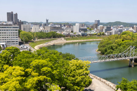 Okayama, Japan- 10 May 2024: View of Asahi river at Okayama city, Japan. Okayama Castle and Korakuen are just on the opposite site of this river.のeditorial素材
