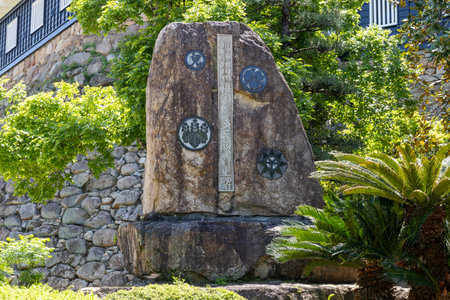 Okayama, Japan- 10 May 2024: Stone tablet bears the family crest of the Ukita family in Okayama Castle, which commemorates the construction of Okayama Castle.のeditorial素材