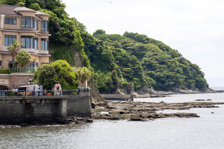 Enoshima, Japan- 14 May, 2024: Rocky shore and sea at Enoshima Island in Japan.のeditorial素材