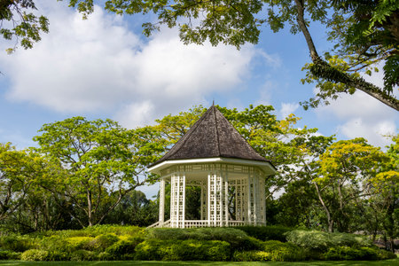 Gazebo or white bandstand at Singapore Botanic Gardens. The Bandstand was erected in 1930 and has retained its original shapeの写真素材