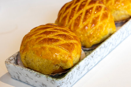 Freshly baked pineapple buns on a plate