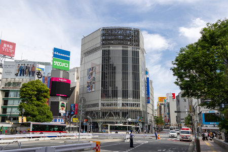 Tokyo, Japan- 12 May 2024: View of Shibuya Scramble Crossing in Tokyo with business billboard on the...