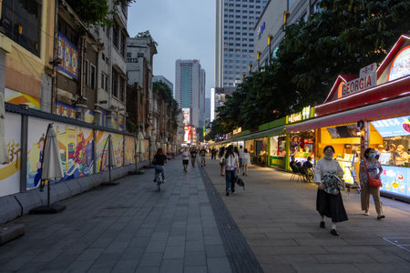 Guangzhou, China- 7 Jun 2024: People walking on Beijing road walking street in Guangzhou. This street has everything on offer from well-known brands to traditional clothingのeditorial素材
