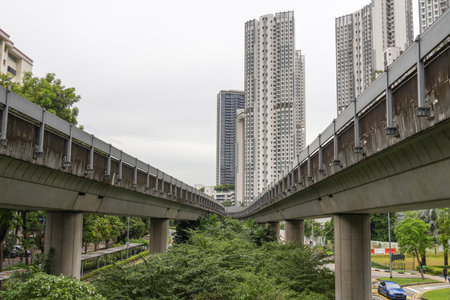 Singapore- 7 May 2024: Observe the Singapore MRT tracks flanked by apartments on both sidesのeditorial素材
