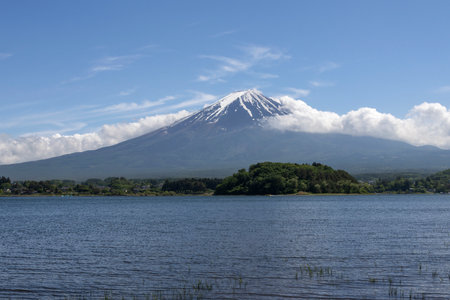 Scenic view of Mount Fuji from Lake Kawaguchiko, Japan. Lake Kawaguchiko serves as the main point of entry to this famous lake regionの写真素材