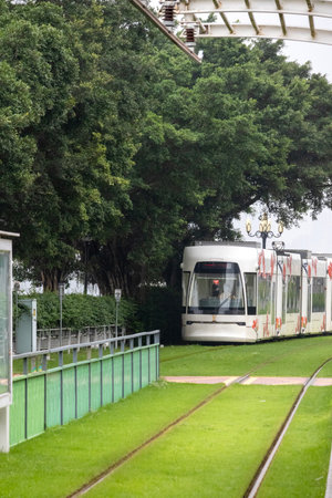 Guangzhou, China- 7 Jun 2024: Guangzhou Haizhu Tram modern light rail public transport in Guangzhou, China. This is a new traffic system,Start running on January 1, 2015のeditorial素材