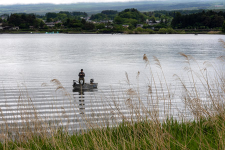 Kawaguchiko, Japan-16 May 2024: Landscape view from Kawaguchiko lake with peoples are fishing and relaxing. Lake Kawaguchi is particularly famous nationwide as a bass fishing hot-spot.のeditorial素材