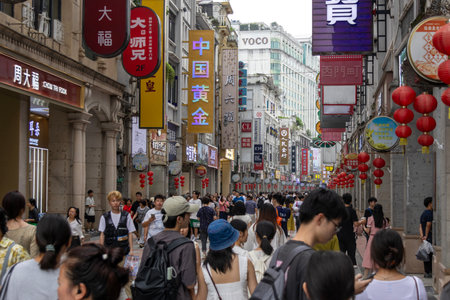 Guangzhou, China- 9 Jun 2024: People shopping at ShangXiaJiu Pedestrian Street in Guangzhou, China. This street is about 800m in length with 250 shops on both sidesのeditorial素材