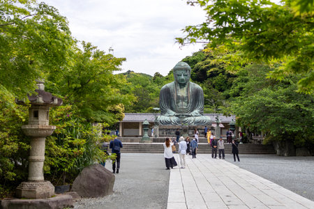 Kamakura, Japan- 14 May, 2024: Scenery of the Great Amida Buddha and tourists in Kamakura. Kamakura Daibutsu is the famous landmark located at the Kotoku-in temple in Kanagawa Prefecture.のeditorial素材