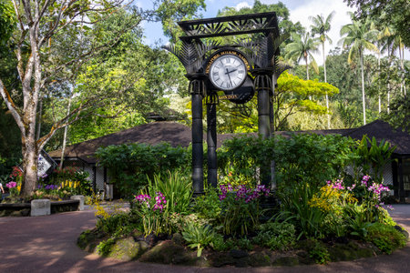 Singapore- 19 Apr, 2024: The Clock Tower inside the Singapore Botanic Garden in Singapore. Singapore Botanic Gardens was inscribed as a UNESCO World Heritage Site on 4th July 2015のeditorial素材