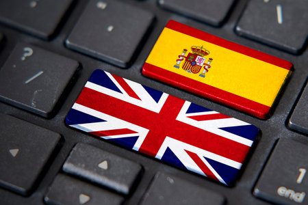 UK and Spain flags on computer keyboard. Relationship between two countries.の写真素材