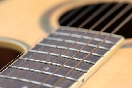 Close-Up Acoustic Guitar strings, with focusing on the detailed strings of the guitarの写真素材